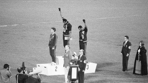 Tommie Smith and John Carlos, gold and bronze medalists in the 200-meter run at the 1968 Olympic Games, raise their fists in the Black Power salute on October 16, 1968, in Mexico City.