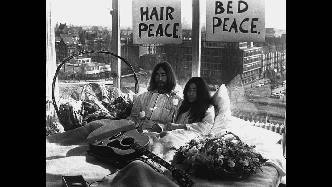 John Lennon and Yoko Ono give a press conference during their "bed-in" for peace at an Amsterdam hotel in March 1969.