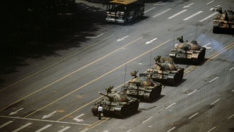 A man in Tiananmen Square stands in front of a column of T-59 tanks on June 4, 1989.