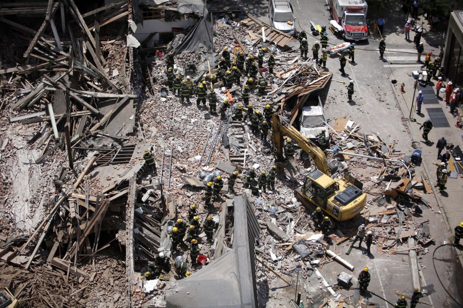 Firefighters sort through the rubble on 22nd and Market Street in Philadelphia, on June 5.
