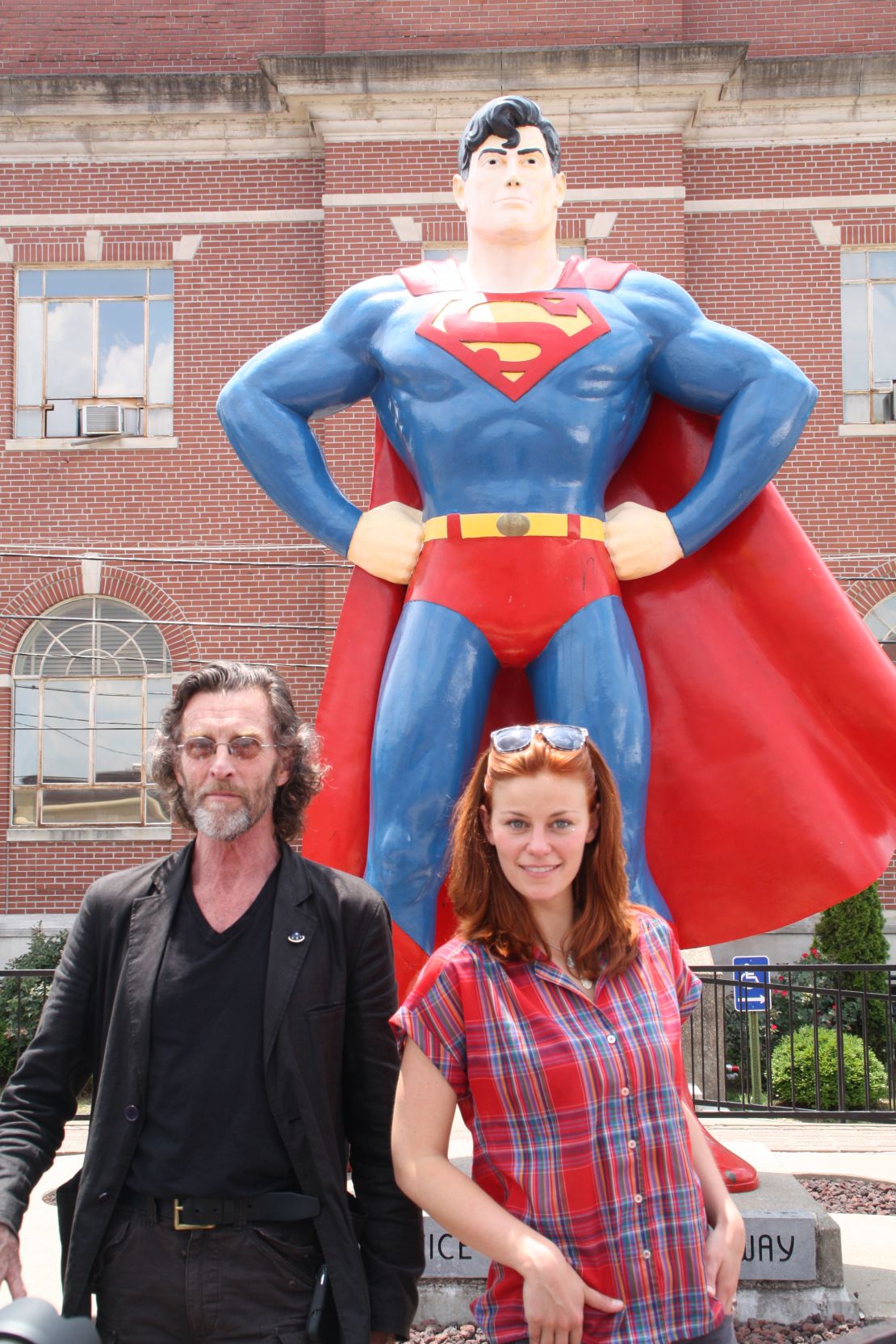 John Glover (left) and Cassidy Freeman from the series "Smallville" are just two to have posed with Superman's legs.