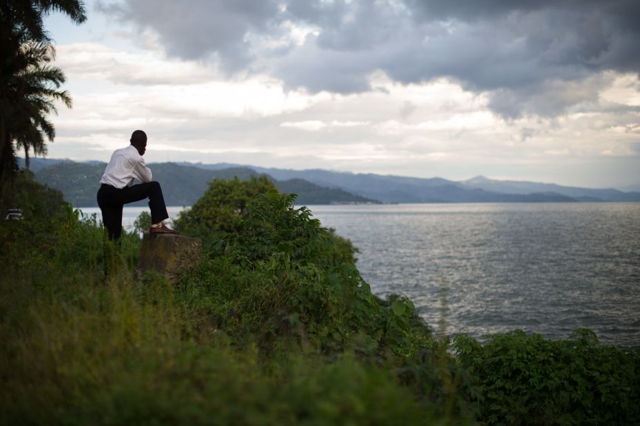 A man looks out toward the hills of Rwanda from the eastern edge of Lake Kivu in the Democratic Republic of the Congo's eastern city of Goma. Congo is the crossroads of Africa, bordered by nine countries. It is the continent's second-largest country in area (behind Algeria) and fourth-largest in population (behind Nigeria, Ethiopia and Egypt).