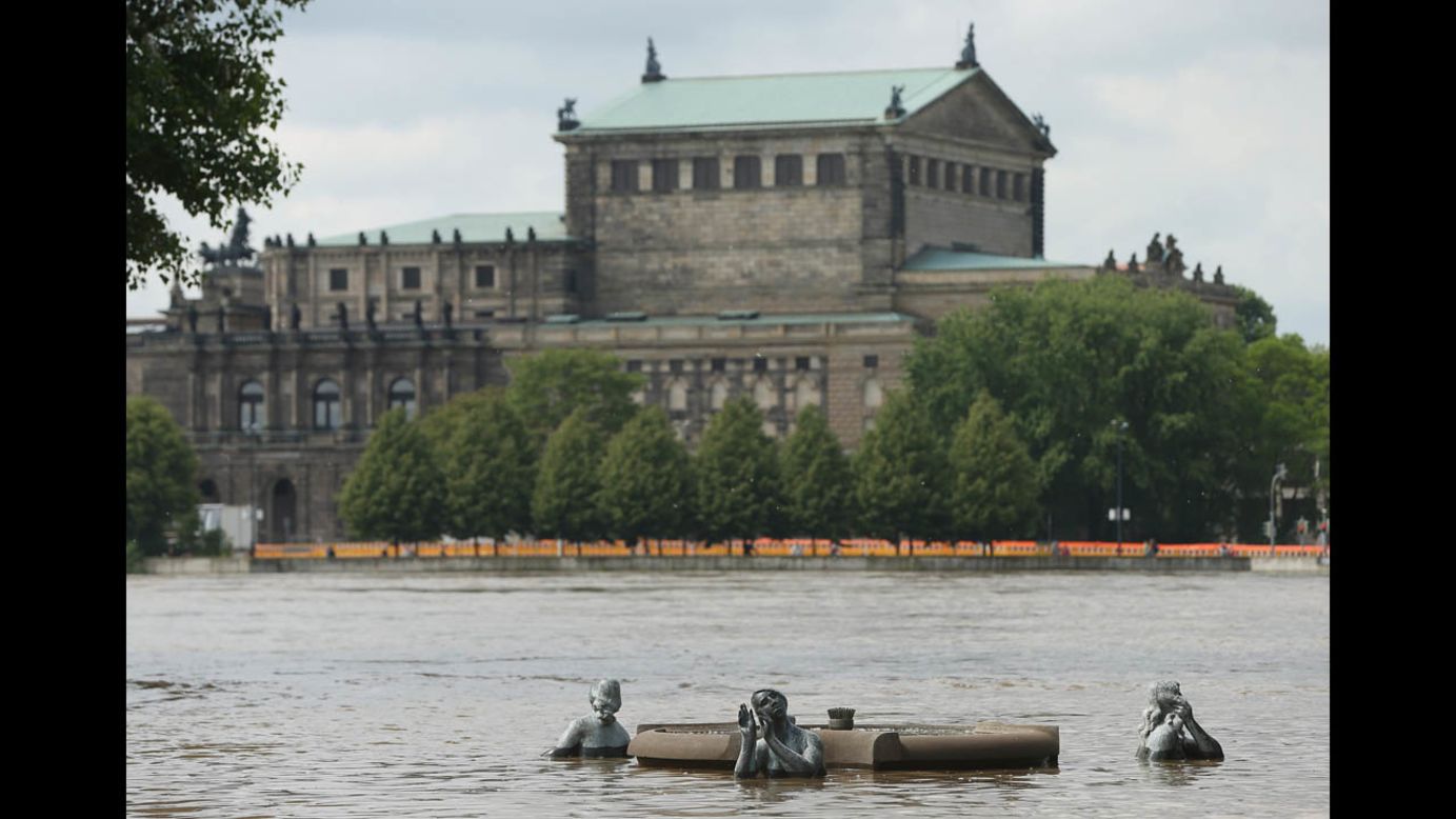 Elbe River floodwaters rise over statues across from the Semper Opera House in Dresden, Germany, on June 6.