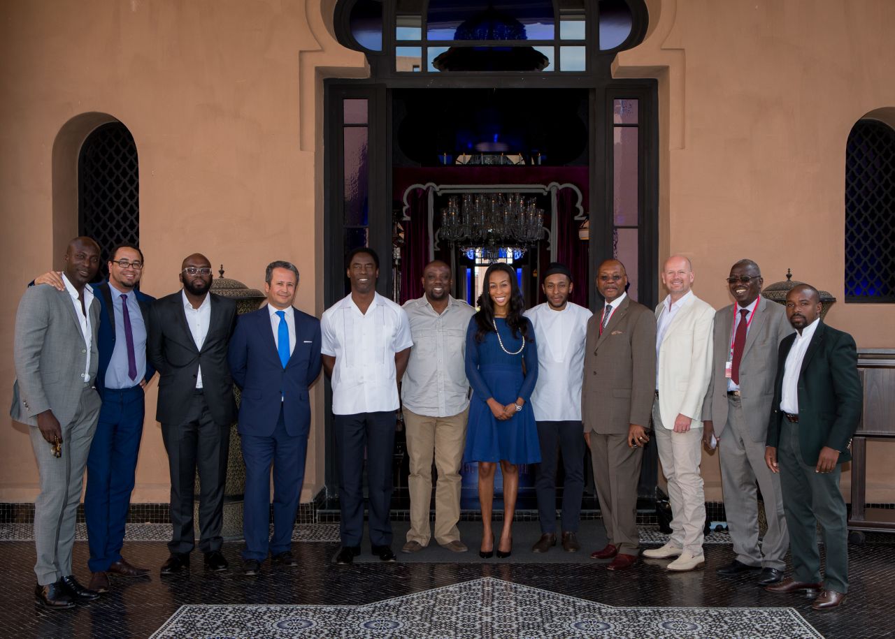 Ozwald Boateng with Made in Africa Foundation supporters at a fund-raising lunch during the AfDB's annual summit. Guests included Chris Cleverly (CEO of MIAF), actor Isaiah Washington, Made in Africa co-founder Kola Aluko, Anne Welsh (Obasanjo Foundation), and actor and MC Mos Def.
