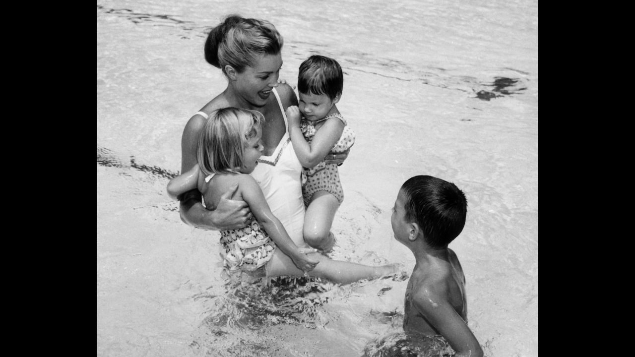 Williams plays with her three children, Susan, Kimball and Ben, circa 1955.