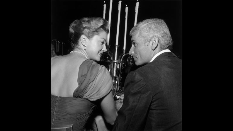 Williams and Jeff Chandler sit together during the WAIF Imperial Ball  at the Beverly Hilton Hotel in Beverly Hills, California, in November 1959.  
