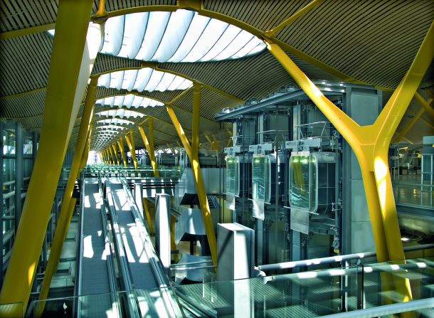 Light comes through large skylights into the circulation systems at Madrid-Barajas Airport's check-in and departures area. 