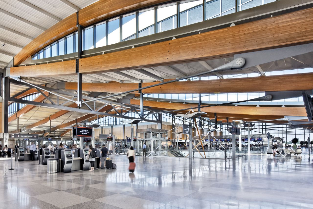 The design of Terminal 2 makes use of wooden trusses, glass and natural light. The rolling roofs are inspired by North Carolina's Piedmont hills. 