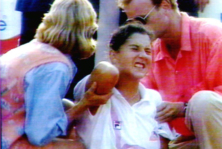 Seles defended all three of her grand slam titles in 1992, and lost in the final at Wimbledon. She then won the  Australian Open for the third time in a row, but the defining moment of her career arrived at the 1993 Hamburg Masters, when a man later identified as an obsessive fan of Graf ran onto the court and stabbed her in the back. Her injuries healed within weeks, but Seles was out of the sport for over two years.