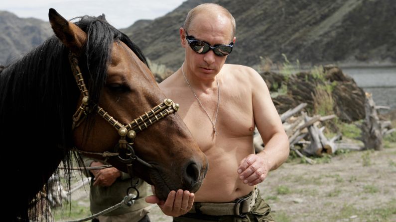 Putin vacations outside the town of Kyzyl in Southern Siberia in 2009. Over the years he has earned <a href="index.php?page=&url=http%3A%2F%2Fwww.cnn.com%2F2012%2F03%2F02%2Feurope%2Fgallery%2Fcult-of-vladimir-putin%2Findex.html">a reputation as a "strongman,"</a> declaring a crackdown on Chechen militants a priority in his first presidential term. 