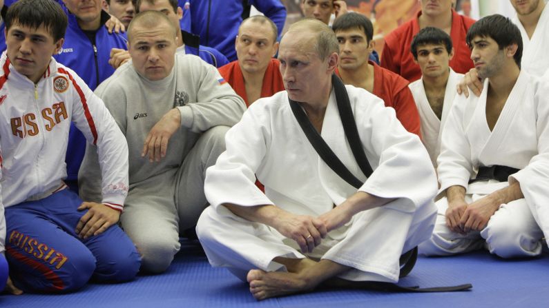 Russian president Vladimir Putin has championed sport, partly as a way of demonstrating the nation's prestige. A keen sportsman, Putin is pictured taking part in a judo training session at a sports complex in St. Petersburg in December 2010. The Russian leader holds a black belt in judo.