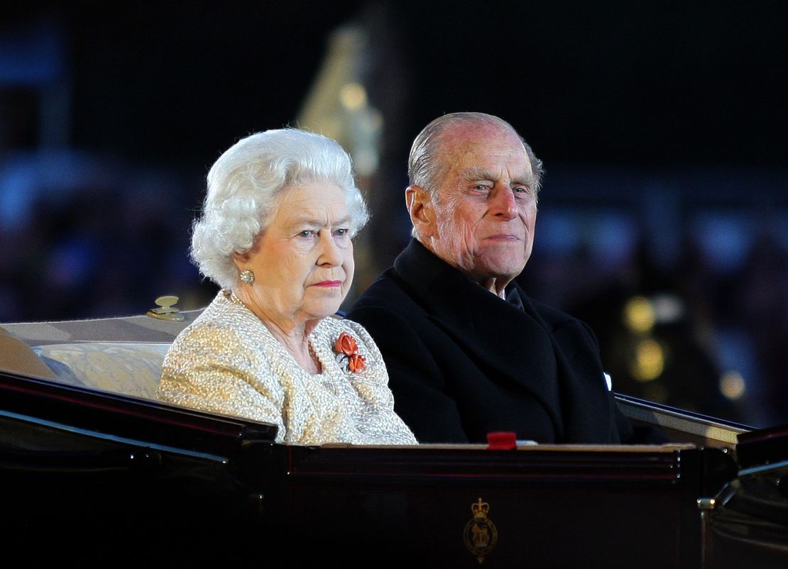 The Queen and Prince Philip arrive at the Diamond Jubilee Pageant in the grounds of Windsor Castle in May 2012.
