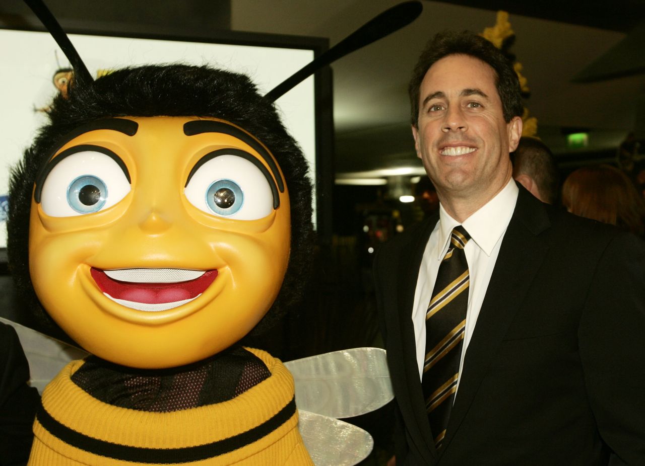 Jerry Seinfeld appears with a giant, costumed bee for a premiere of his film "Bee Movie" in November 2007 in Brussels, Belgium.  