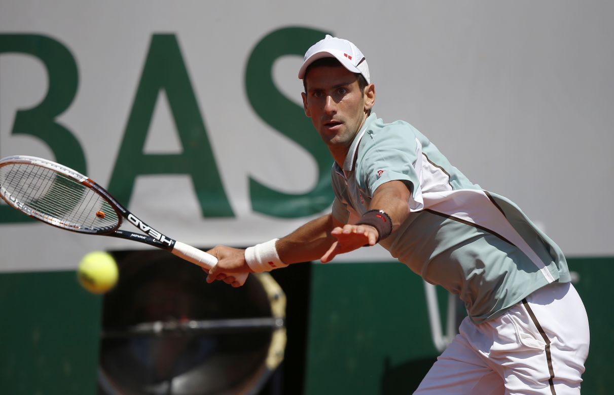 Djokovic returns a shot to Nadal on June 7.