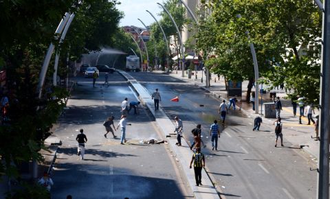 In the Turkish capital, Ankara, Saturday, iReporter <a href="http://ireport.cnn.com/docs/DOC-981195">Duygu Cihanger</a> shot scenes of protesters ahead of what appears to be a police van firing a water cannon.