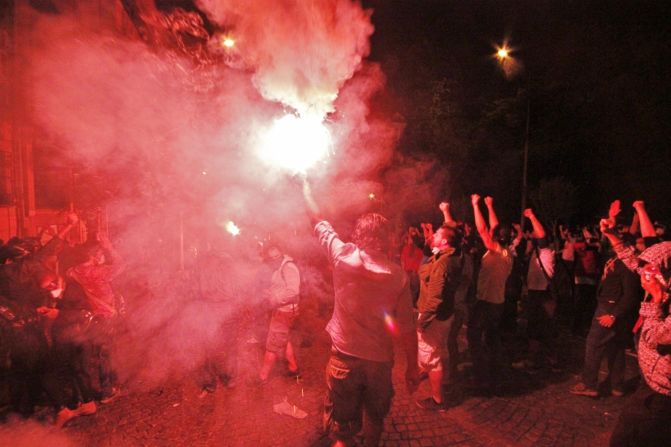 Cities in Turkey have been rocked by days of anti-government protests. This image by iReporter <a href="http://ireport.cnn.com/docs/DOC-982924">Nate Hovee</a> from Sunday shows protesters chanting and surrounding a flare in Istanbul.