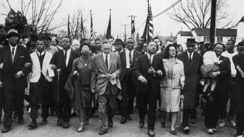 1965: Martin Luther King and his wife Coretta Scott King lead a voting rights march from Selma, Alabama, to the state capital in Montgomery.