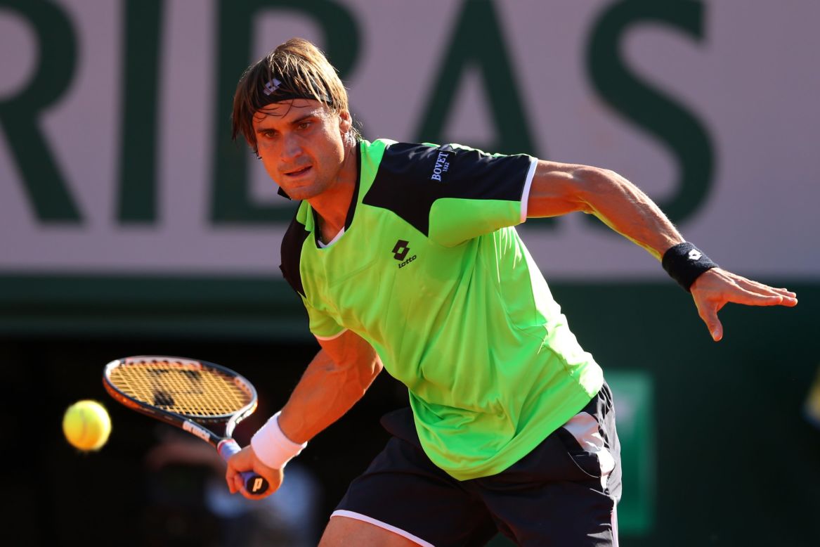 Ferrer plays a forehand to Tsonga on June 7.