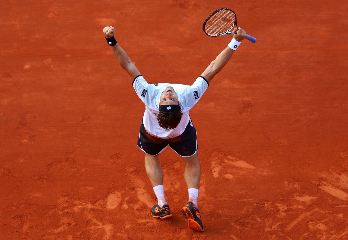 David Ferrer of Spain celebrates after defeating Jo-Wilfried Tsonga of France at the French Open at Roland Garros on Friday, June 7.  Ferrer won 6-1, 7-6(3), 6-2 . Click through to see more tennis action.