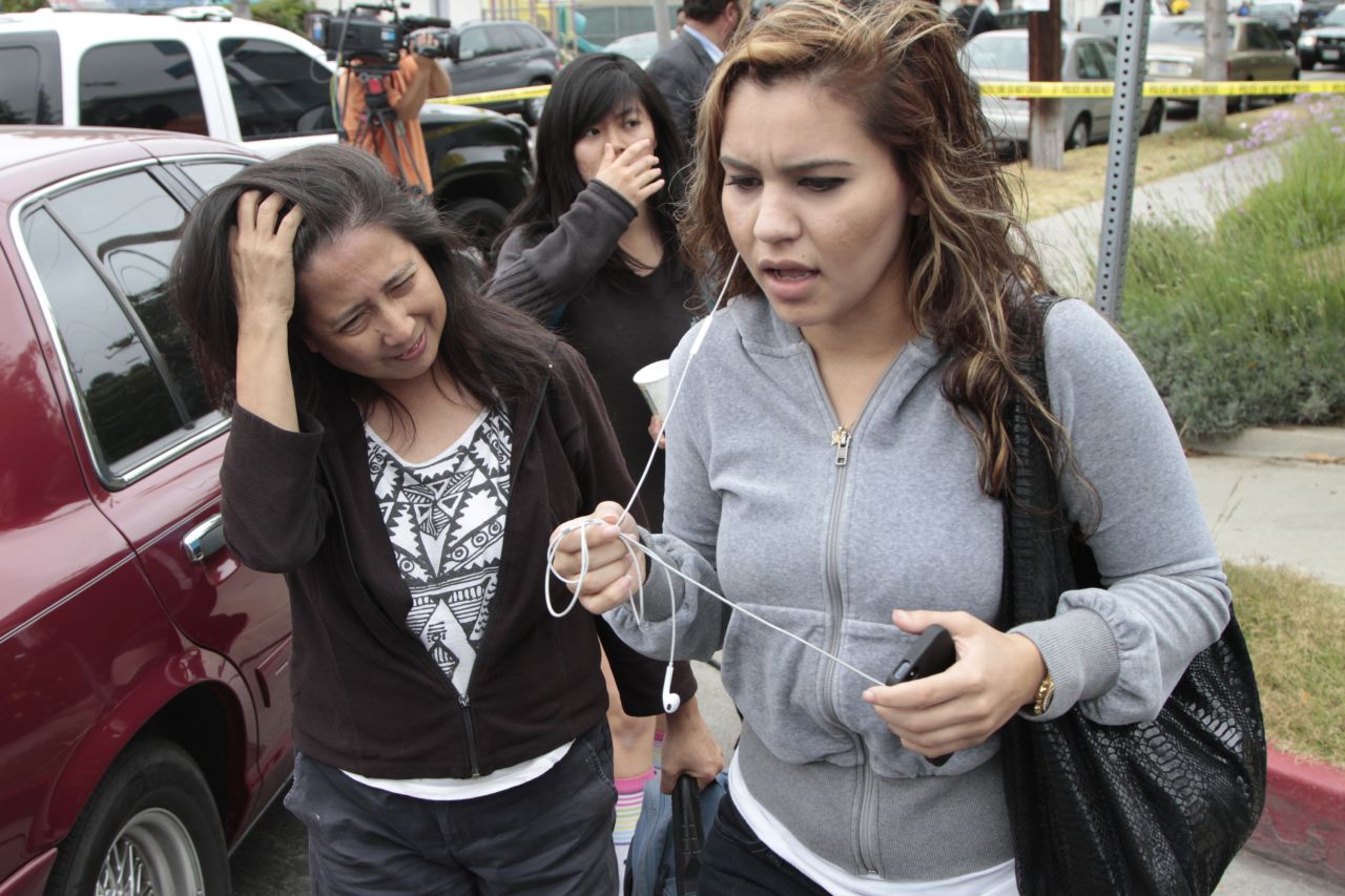 Women leave campus after the shooting.  