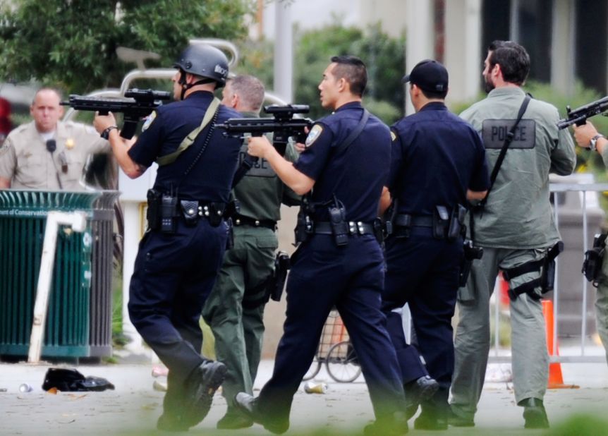 Los Angeles Police Department officers along with Los Angeles County Sheriff deputies search the campus of Santa Monica College after a reported shooting on Friday, June 7.  