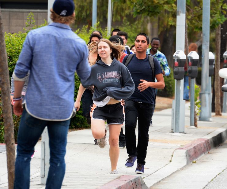  Students rush to safety after shots were fired.