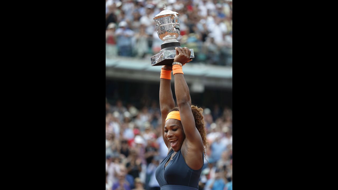 Williams celebrates with the Coupe Suzanne Lenglen trophy following her victory on June 8.