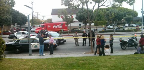 <a href="http://ireport.cnn.com/docs/DOC-984881">iReporter Nathaniel Westveer</a> photographed the chaotic scene right outside his office building, which is 100 feet away from the crime scene at Santa Monica College. He says during the shooting, police closed down the intersection as they combed the adjacent office complex with their guns drawn.