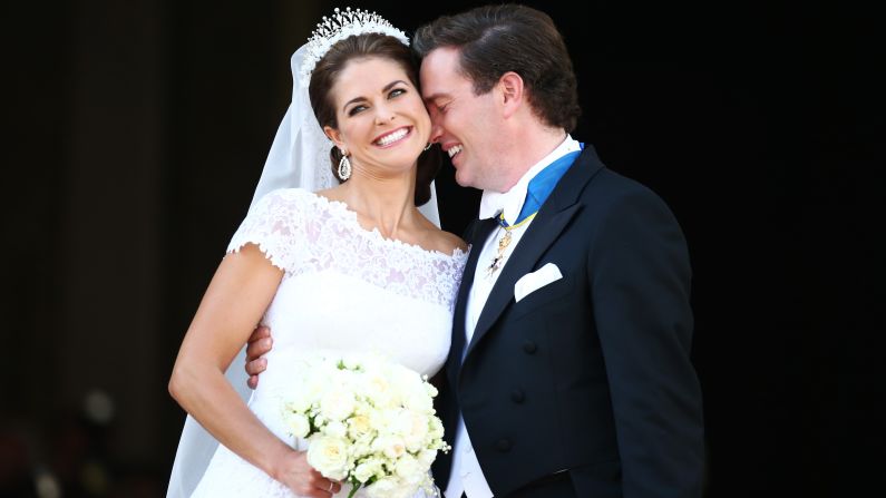 Princess Madeleine of Sweden and Christopher O'Neill appear on the balcony after their wedding ceremony hosted by King Carl Gustaf XIV and Queen Silvia at the Royal Palace in Stockholm on Saturday, June 8.