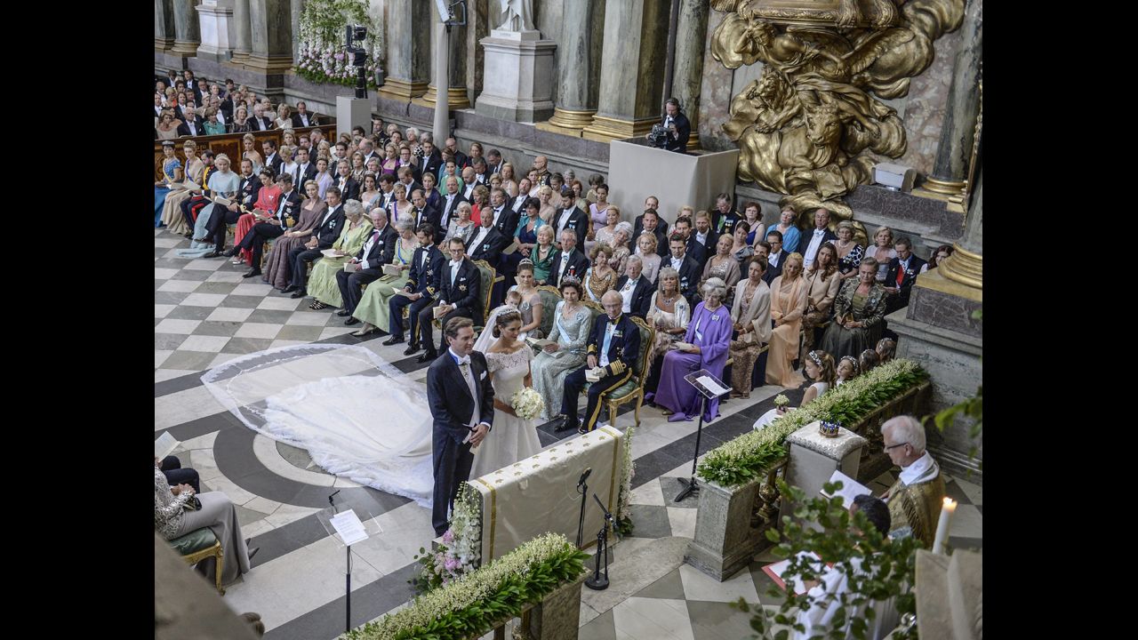 Princess Madeleine and Christopher O'Neill stand at the alter at the Royal Chapel in Stockholm.