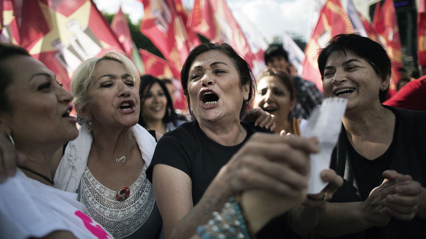 Women sing as people gather at Kizilay Square in Ankara on June 8.