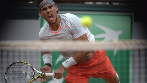 Spain's Rafael Nadal serves to Spain's David Ferrer during the men's singles final match of the French Open at Roland Garros Stadium in Paris on Sunday, June 9.