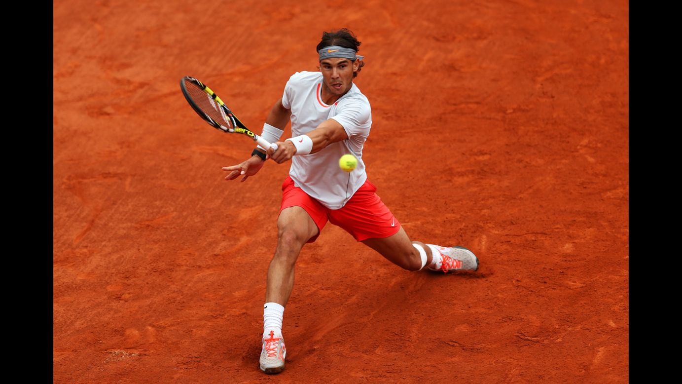 Nadal plays a backhand against Ferrer.