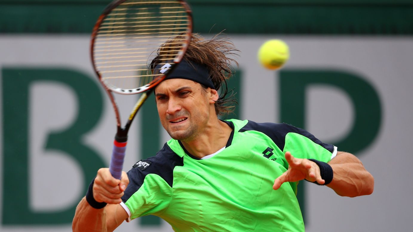 Ferrer plays a forehand against Nadal.