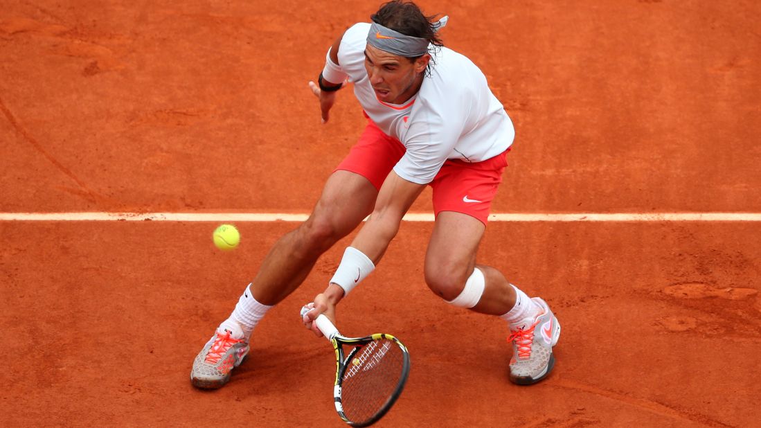 Nadal plays a forehand to Ferrer.