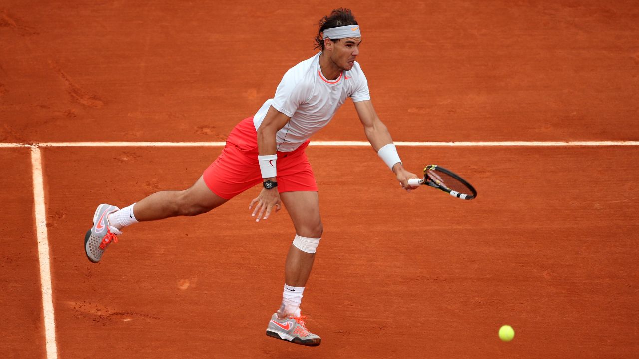 Nadal plays a forehand against Ferrer.