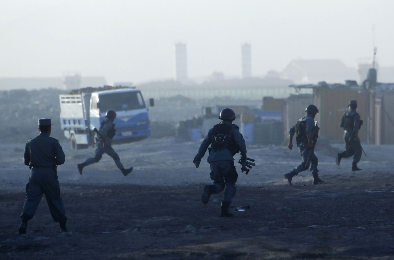 Afghan police arrive at the site of an attack in Kabul on Monday, June 10. Taliban fighters, armed with guns and explosives, clashed with security forces after taking over a building near Kabul International Airport on Monday. The fighting ended with all seven attackers dead, Afghan officials said.<br />