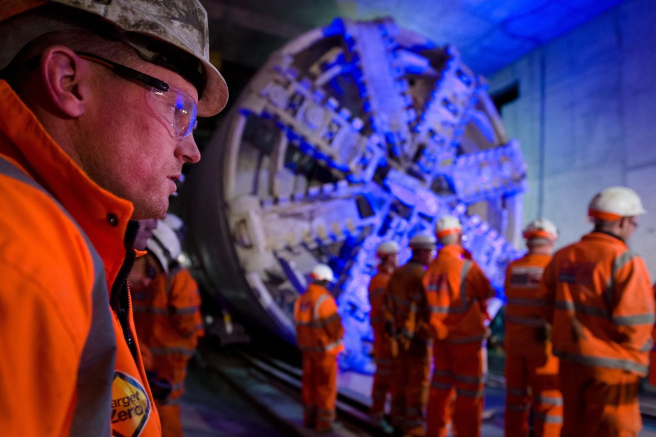 Crossrail construction workers stand near to one of the projects mammoth 1,000-ton tunnel boring machines. The $23 billion development will connect London from east to west, improving access to Heathrow Airport as well as the city's suburban and satellite towns.