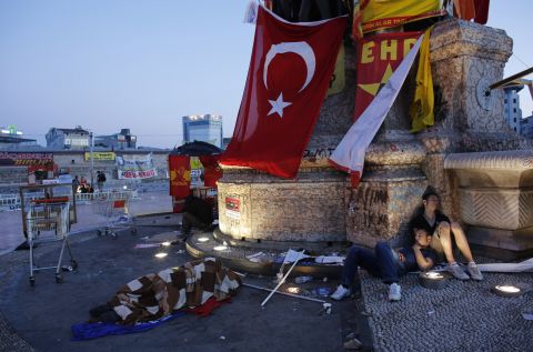 Protesters sleep at Taksim Square in central Istanbul on June 10. Prime Minister Recep Tayyip Erdogan warned protesters who have taken to the streets demanding his resignation that his patience has its limits and compared the unrest with an army attempt six years ago to curb his power.