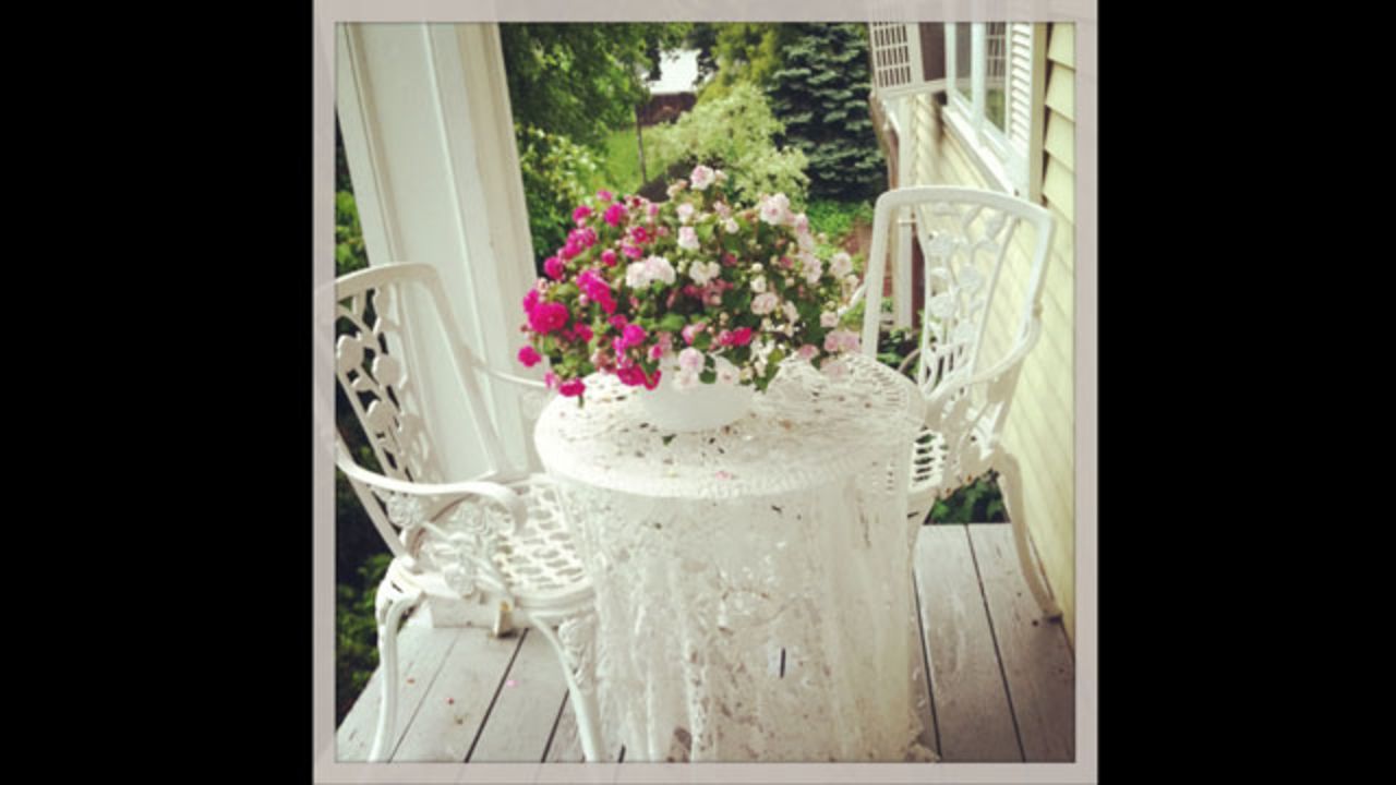 A cozy spot for tea is how iReporter and photographer <a href="http://ireport.cnn.com/people/suzqboyle">Susan Boyle</a> likes to think of her small front porch. Vintage style and an air of romance -- she used colors from her wedding bouquet to dress the porch this year -- greet her as she sips her morning coffee and watches her kids walk off to school, she said.