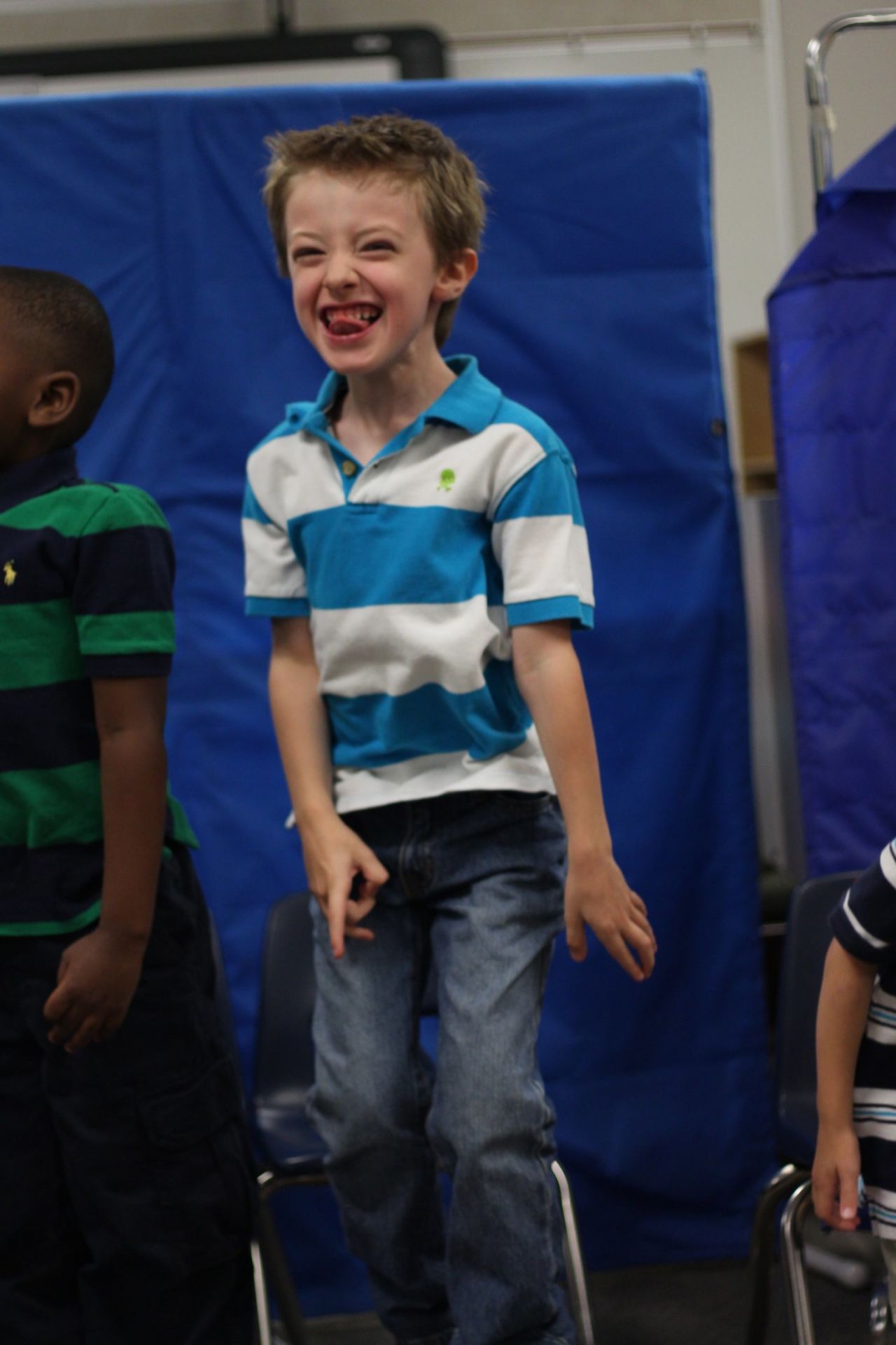 <a href="http://ireport.cnn.com/docs/DOC-984449">Marshall Griffin</a> received the "Best Reader" award at his graduation from D.P. Morris Elementary in Arlington, Texas. Part of their graduation ceremony was performing songs for the parents. In this picture, he is hopping up and down, singing one of the songs. Many of the children in his class, including Marshall, are on the autism spectrum. "The teacher also gave a little speech about the year she's had with the children, and she cried, making all of us cry," said Marshall's mom, Roni. 