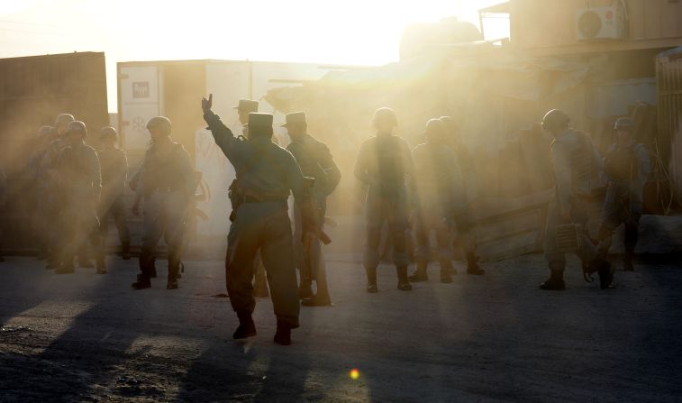 Afghan police take position near the Kabul airport on June 10.