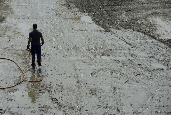 A man walks through the mud in the village of Fischerdorf near Deggendorf, southern Germany, on June 7. 