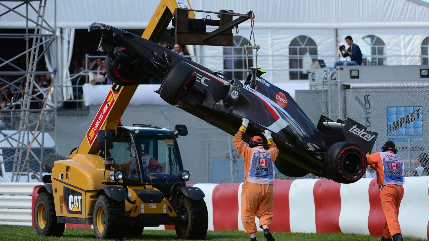 A crane lifts Esteban Gutierrez's Sauber car at the end of Sunday's Canadian Grand Prix at the Circuit Gilles Villeneuve.