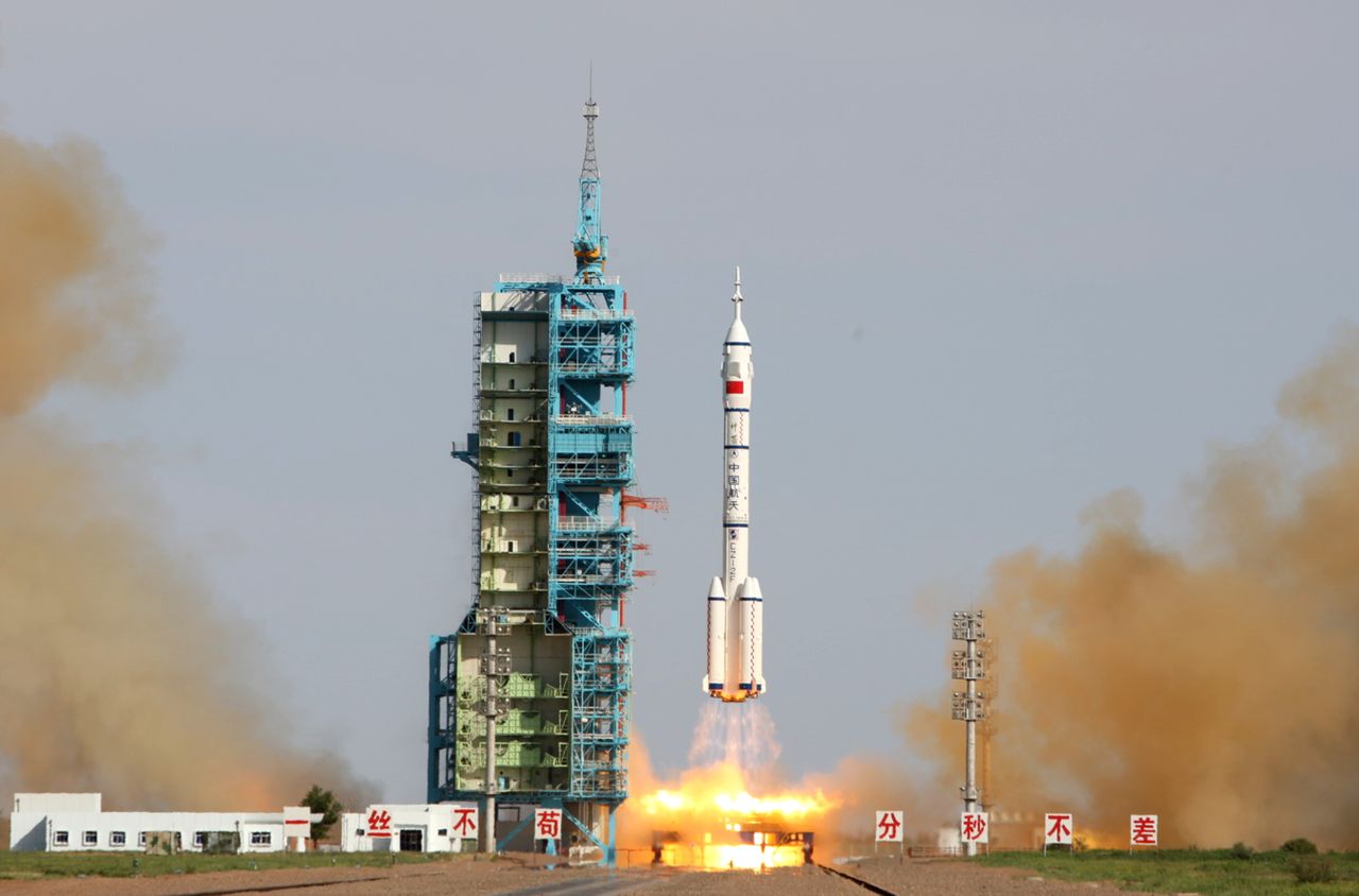 China's Shenzhou 10 rocket blasts off from the Gobi Desert in the city of Jiuquan, in  China's Gansu province, on Tuesday, June 11. The craft is scheduled to dock with the Tiangong-1 space module, where the three crew members will transfer supplies to the space lab, which has been in orbit since September 2011. 