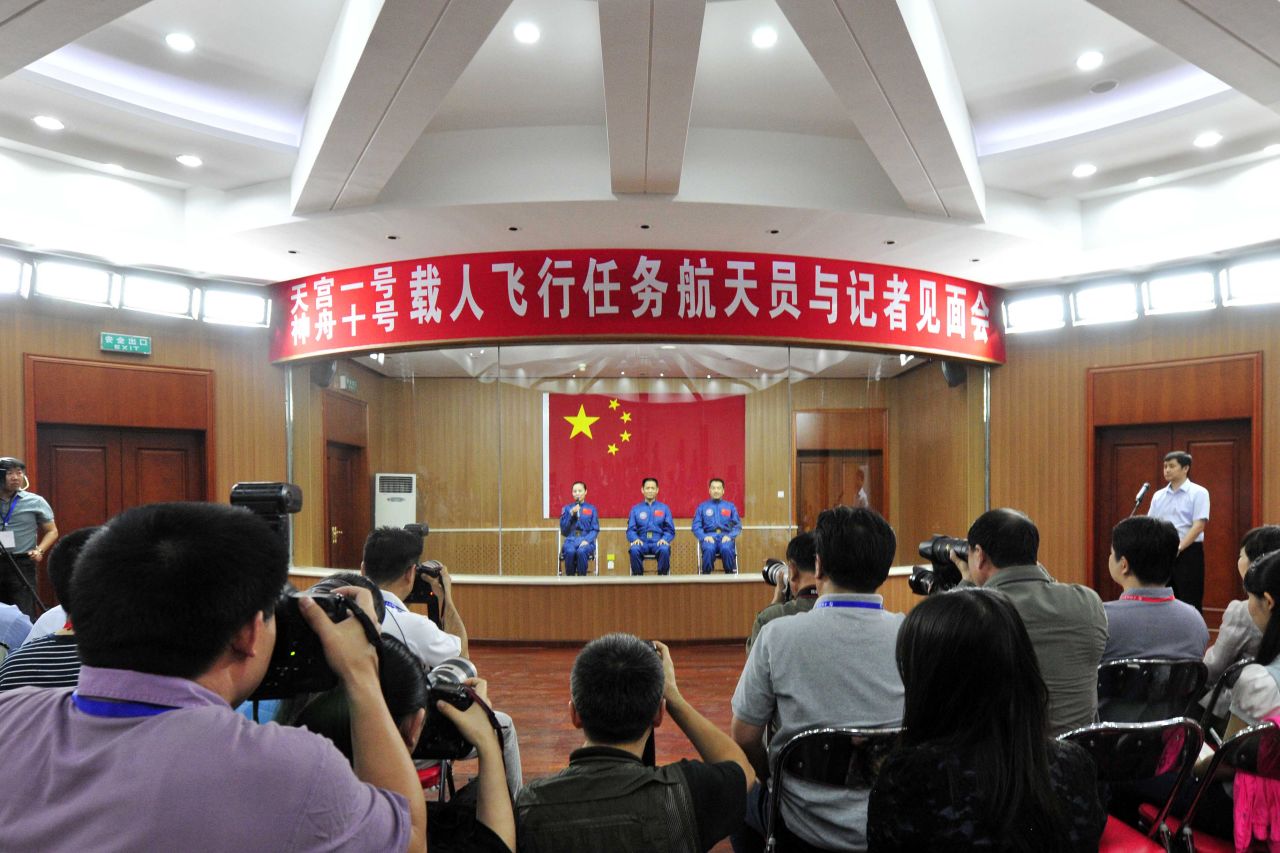 The crew attend a press conference in Jiuquan on Monday, June 10.