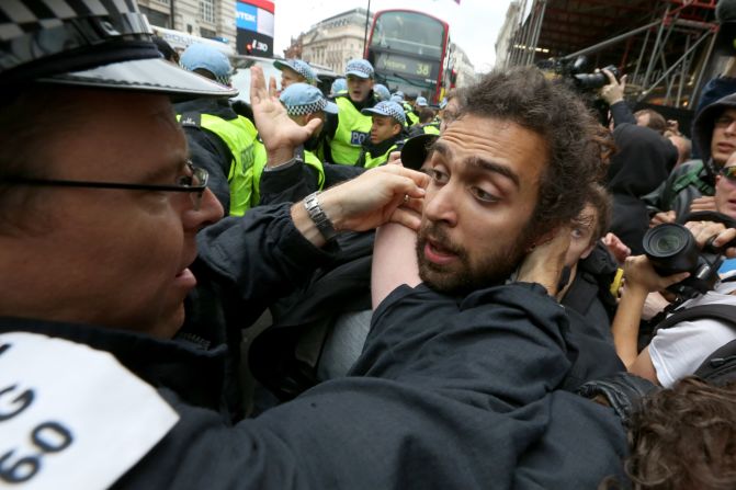 A police officer scuffles with a protester in Soho on June 11.