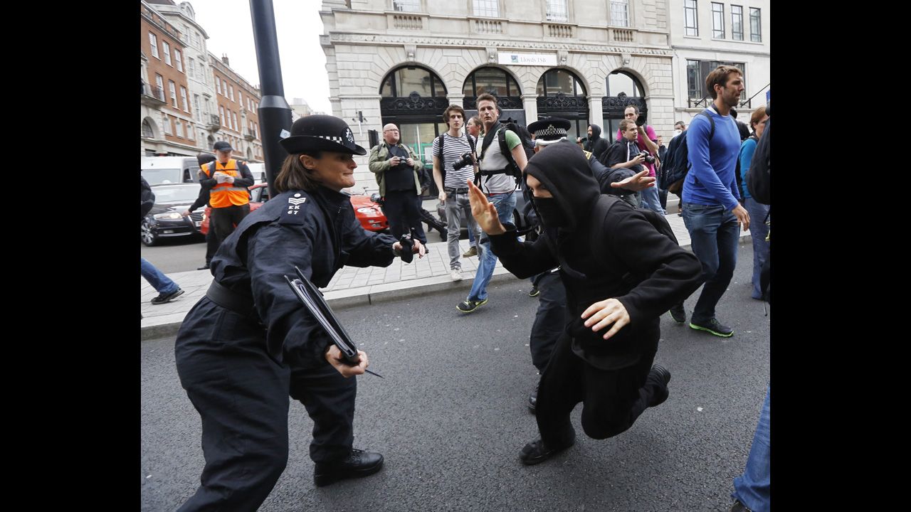  A protester tries to evade a police officer in Soho on June 11.