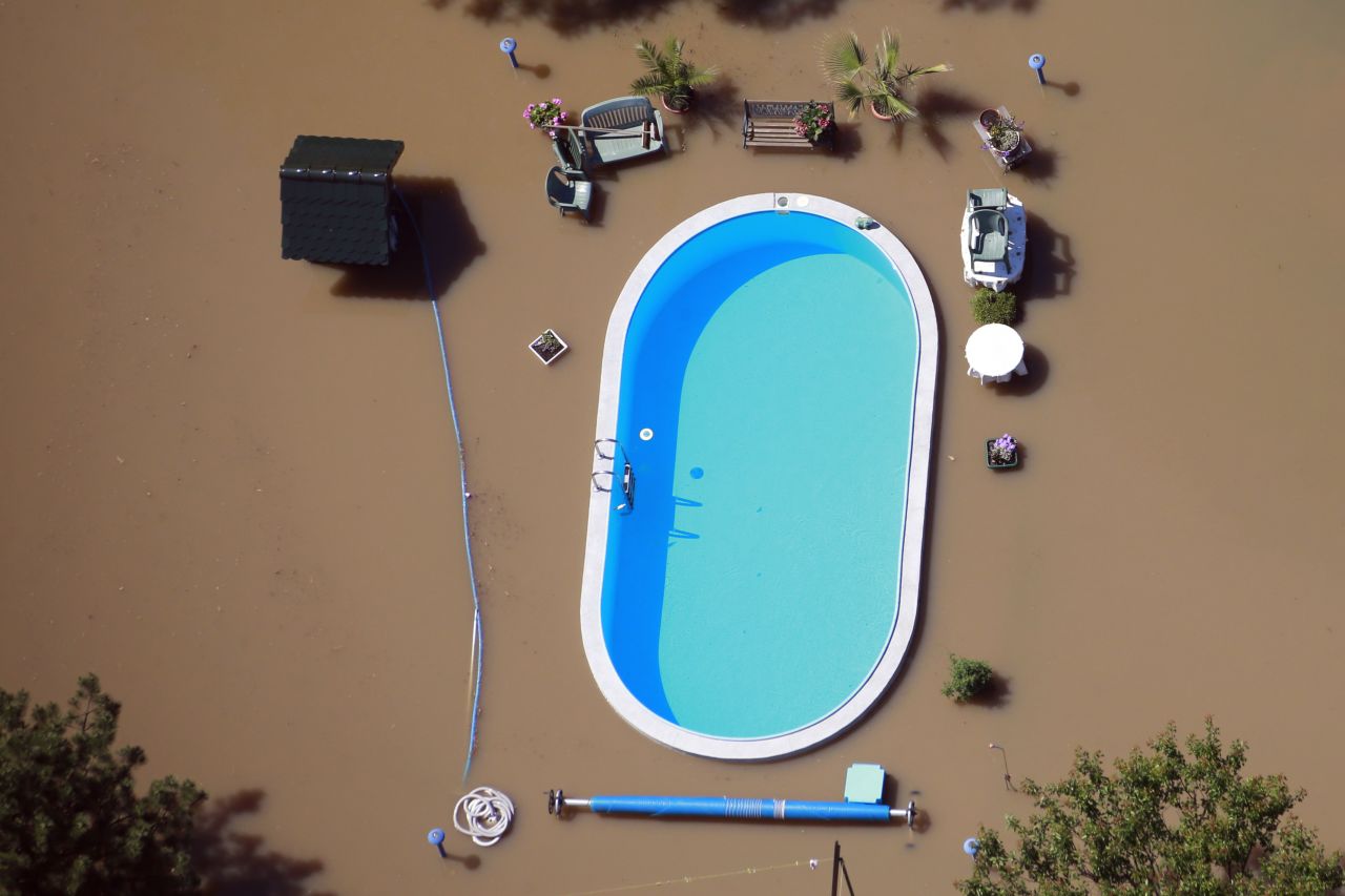 Floodwaters from the Elbe River inundate a yard with a swimming pool near Magdeburg, Germany, on Monday, June 10.