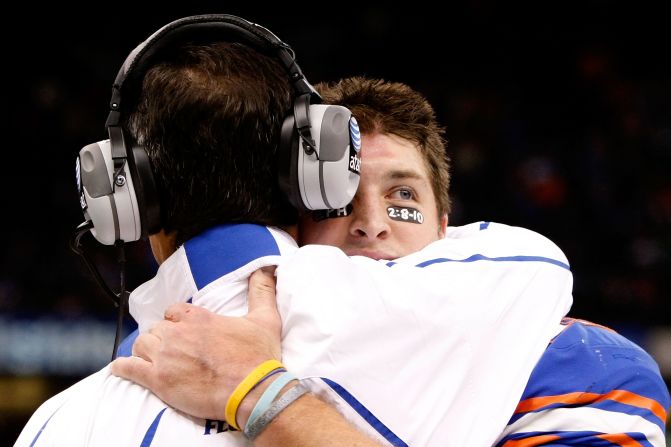 Tebow hugs Florida head coach Urban Meyer during the Sugar Bowl in January 2010. In what was Tebow's last college game, he threw for a career-high 482 yards and ran for another 51 yards. Florida defeated Cincinnati 51-24.